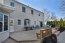 Large deck overlooks pool and yard no image