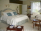 Master bedroom with seating area & private balcony no image
